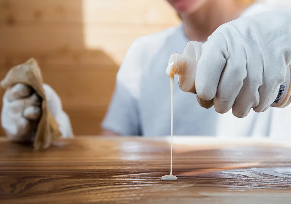 person waxing a hardwood