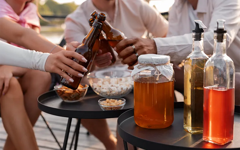 group of friends toasting and eating some snacks