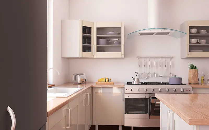 Wide view of a kitchen counter with white cabinets